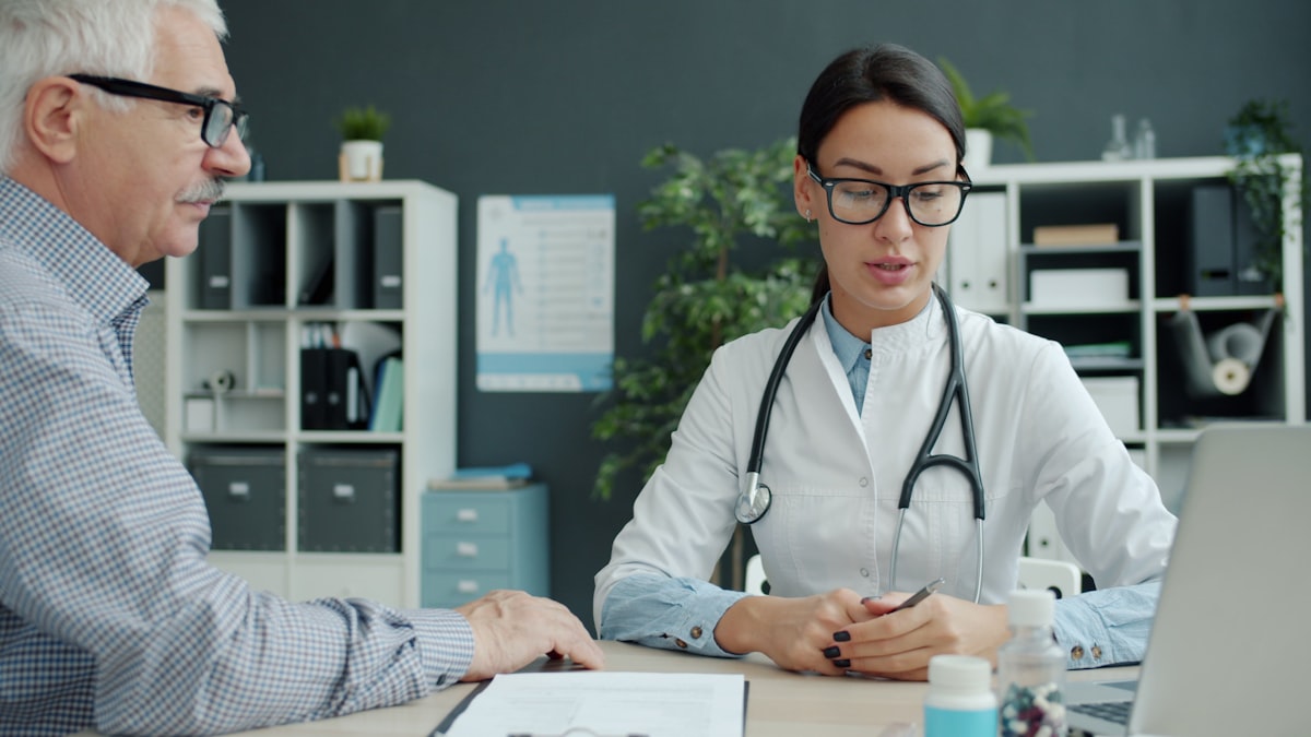 A clinician holding a patient's hand