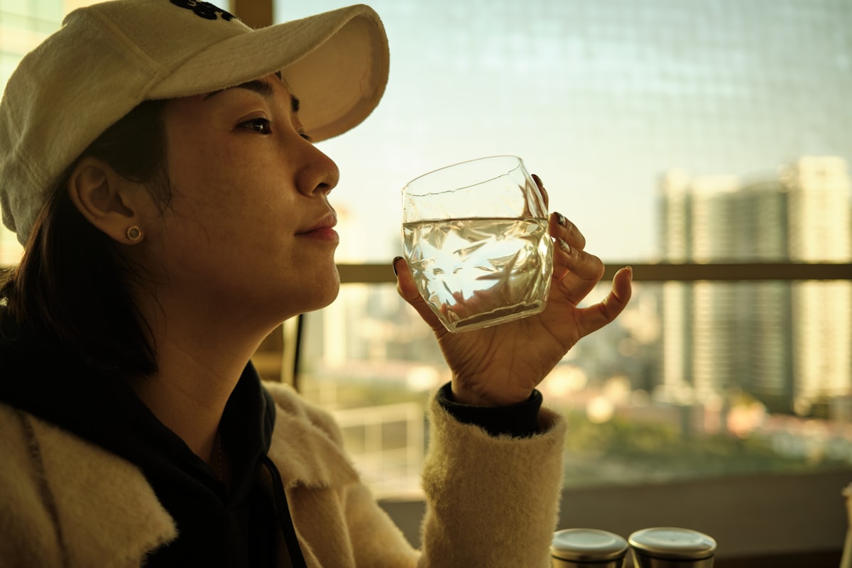 Woman cooling off near a window