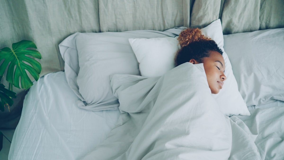 Woman resting peacefully in soft morning light